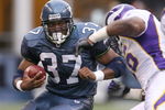 SEATTLE - AUGUST 25:  Shaun Alexander #37 of the Seattle Seahawks rushes against E.J. Henderson #56 of the Minnesota Vikings during a preseason game at Qwest Field August 25, 2007 in Seattle, Washington.  The Seahawks defeated the Vikings 30-13. (Photo by Otto Greule Jr/Getty Images)