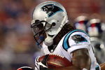 EAST RUTHERFORD, NJ - AUGUST 17:  DeAngelo Williams #34 of the Carolina Panthers runs the ball against the New York Giants on August 17, 2009 at Giants Stadium in East Rutherford, New Jersey. The Giants defeated the Panthers 24-17.  (Photo by Jim McIsaac/Getty Images)