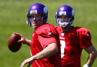 EDEN PRAIRIE, MN - AUGUST 18:  Brett Favre #4 (L) throw a pass during a Minnesota Vikings practice session as John David Boty watches on August 18, 2009 at Winter Park in Eden Prairie, Minnesota. Favre has reportedly agreed to play for the Vikings, a reversal of his announced retirement.  (Photo by Scott A. Schneider/Getty Images)