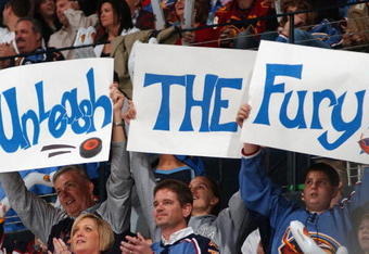 ATLANTA - MARCH 4:  Atlanta Thrashers fans hold up signs during the game against the Carolina Hurricanes on March 4, 2007 at Philips Arena in Atlanta, Georgia. The Thrashers won 3-1. (Photo by Scott Cunningham/Getty Images)