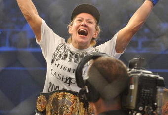 SAN JOSE, CA - AUGUST 15:  Cris Cyborg celebrates after defeating Gina Carano during their Middleweight  Championship Title fight at Stikeforce: Carano vs. Cyborg on August 15, 2009 in San Jose, California.  (Photo by Jon Kopaloff/Getty Images)