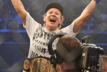 SAN JOSE, CA - AUGUST 15:  Cris Cyborg celebrates after defeating Gina Carano during their Middleweight  Championship Title fight at Stikeforce: Carano vs. Cyborg on August 15, 2009 in San Jose, California.  (Photo by Jon Kopaloff/Getty Images)