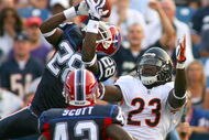 ORCHARD PARK, NY - AUGUST 15: Leodis McKelvin #28 of the Buffalo Bills intercepts a pass from Jay Cutler (not shown) intended for Devin Hester # 23 of the Chicago Bears on August 15, 2009 at Ralph Wilson Stadium in Orchard Park, New York. Bryan Scott #43 of the Bills looks on. (Photo by Rick Stewart/Getty Images)