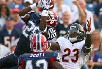 ORCHARD PARK, NY - AUGUST 15: Leodis McKelvin #28 of the Buffalo Bills intercepts a pass from Jay Cutler (not shown) intended for Devin Hester # 23 of the Chicago Bears on August 15, 2009 at Ralph Wilson Stadium in Orchard Park, New York. Bryan Scott #43 of the Bills looks on.  (Photo by Rick Stewart/Getty Images)