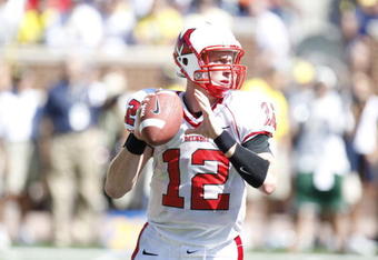 ANN ARBOR, MI - SEPTEMBER 6:  Quarterback Daniel Raudabaugh  #12 of the Miami of Ohio Red Hawks looks to make a pass play during the game against the Michigan Wolverines on September 6, 2008 at Michigan Stadium in Ann Arbor, Michigan.  The Wolverines defeated the Red Hawks 16-6. (Photo by Gregory Shamus/Getty Images)