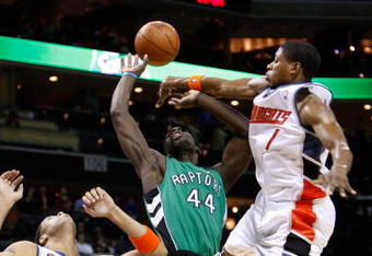 CHARLOTTE, NC - MARCH 16:  Pops Mensah-Bonsu #44 of the Toronto Raptors is caught between Sean May #42 and Cartier Martin #1 of the Charlotte Bobcats at Time Warner Cable Arena on March 16, 2009 in Charlotte, North Carolina.  NOTE TO USER: User expressly acknowledges and agrees that, by downloading and/or using this Photograph, user is consenting to the terms and conditions of the Getty Images License Agreement.  (Photo by Streeter Lecka/Getty Images)
