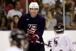 WOODRIDGE, IL - AUGUST 18:  Patrick Kane plays keep-away with kids during a skate-around as part of the USA Olympic Men's Ice Hockey Orientation Camp on August 18, 2009 at Seven Bridges Ice Arena in Woodridge, Illinois.  (Photo by Jamie Squire/Getty Images)