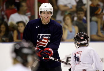 WOODRIDGE, IL - AUGUST 18:  Patrick Kane plays keep-away with kids during a skate-around as part of the USA Olympic Men's Ice Hockey Orientation Camp on August 18, 2009 at Seven Bridges Ice Arena in Woodridge, Illinois.  (Photo by Jamie Squire/Getty Images)