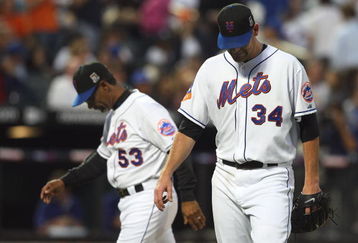 NEW YORK - JULY 07:  Mike Pelfrey #34 of the New York Mets is removed from the game in the fourth inning against the Los Angeles Dodgers by manager Jerry Manuel #53 on July 7, 2009 at Citi Field in the Flushing neighborhood of the Queens borough of New York City.  (Photo by Jim McIsaac/Getty Images)