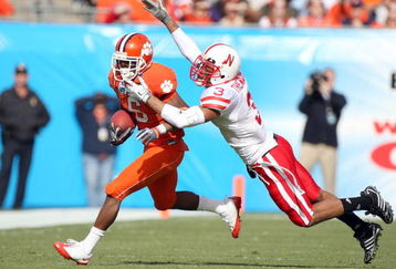 JACKSONVILLE, FL - JANUARY 1:  Jacoby Ford #6 of the Clemson Tigers is tackled by Rickey Thenarse #3 of the Nebraska Cornhuskers during the Konica Minolta Gator Bowl at Jacksonville Municipal Stadium January 1, 2009 in Jacksonville, Florida.  (Photo by Sam Greenwood/Getty Images)