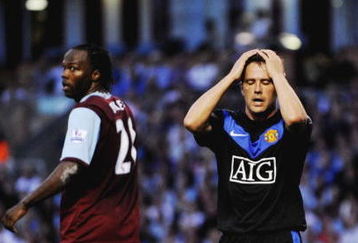BURNLEY, ENGLAND - AUGUST 19:  Michael Owen of Manchester United holds his head during the Barclays Premier League match between Burnley and Manchester United at Turf Moor on August 19, 2009 in Burnley, England.  (Photoby Laurence Griffiths/Getty Images)