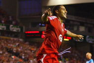 LIVERPOOL, ENGLAND - AUGUST 19:  Glen Johnson of Liverpool celebrates scoring his team's second goal during the Barclays Premier League match between Liverpool and Stoke City at Anfield on August 19, 2009 in Liverpool, England.  (Photo by Clive Brunskill/Getty Images)