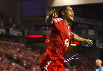 LIVERPOOL, ENGLAND - AUGUST 19:  Glen Johnson of Liverpool celebrates scoring his team's second goal during the Barclays Premier League match between Liverpool and Stoke City at Anfield on August 19, 2009 in Liverpool, England.  (Photo by Clive Brunskill/Getty Images)