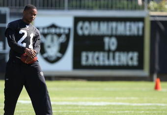 NAPA, CA - AUGUST 05:  Nnamdi Asomugha #21 looks on during the Oakland Raiders Training Camp at the Napa Valley Marriott on August 5, 2009 in Napa, California.  (Photo by Jed Jacobsohn/Getty Images)