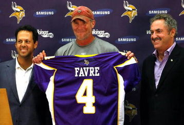 EDEN PRAIRIE, MN - AUGUST 18: Brett Favre (C), Mark Wilf (L) and Zygi Wilf show the media Favre's Minnesota Vikings jersey on August 18, 2009 at Winter Park in Eden Prairie, Minnesota. (Photo by Scott A. Schneider/Getty Images)