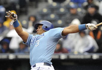 KANSAS CITY, MO - APRIL 12:  Brayan Pena #3 of the Kansas City Royals hits an RBI single to score Tony Pena Jr. in the eighth inning against the New York Yankees on April 12, 2009 at Kauffman Stadium in Kansas City, Missouri. The Royals won 6-4. (Photo by G. Newman Lowrance/Getty Images)