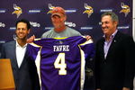 EDEN PRAIRIE, MN - AUGUST 18: Brett Favre (C), Mark Wilf (L) and Zygi Wilf show the media Favre's Minnesota Vikings jersey on August 18, 2009 at Winter Park in Eden Prairie, Minnesota. (Photo by Scott A. Schneider/Getty Images)