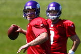 EDEN PRAIRIE, MN - AUGUST 18:  Brett Favre #4 (L) throw a pass during a Minnesota Vikings practice session as John David Boty watches on August 18, 2009 at Winter Park in Eden Prairie, Minnesota. Favre has reportedly agreed to play for the Vikings, a reversal of his announced retirement.  (Photo by Scott A. Schneider/Getty Images)