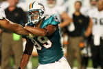 MIAMI - AUGUST 17:  Defensive end Jason Taylor #99 of the Miami Dolphins fights off a block against the Jacksonville Jaguars during a preseason game at Landshark Stadium on August 17, 2009 in Miami, Florida.  (Photo by Doug Benc/Getty Images)