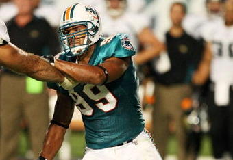 MIAMI - AUGUST 17:  Defensive end Jason Taylor #99 of the Miami Dolphins fights off a block against the Jacksonville Jaguars during a preseason game at Landshark Stadium on August 17, 2009 in Miami, Florida.  (Photo by Doug Benc/Getty Images)