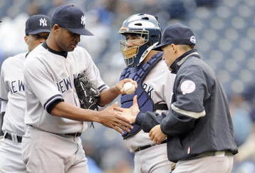KANSAS CITY, MO - APRIL 12:  Damaso Marte #43 of the New York Yankees is relieved by manager Joe Girardi #27 against the Kansas City Royals on April 12, 2009 at Kauffman Stadium in Kansas City, Missouri. (Photo by G. Newman Lowrance/Getty Images)