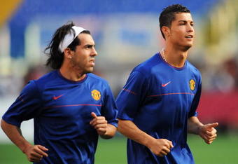 ROME - MAY 26:  Carlos Tevez and Cristiano Ronaldo of Manchester United run as they attend the Manchester United training session prior to UEFA Champions League Final versus Barcelona at the Stadio Olimpico on May 26, 2009 in Rome, Italy.  (Photo by Shaun Botterill/Getty Images)