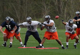 LAKE FOREST, IL - MAY 01: (L-R) Dave Peck #75, Marcus Freeman #58, Jarron Gilbert#73 and Al Afalava #46 of the Chicago Bears participate in a special teams drill during a rookie mini-camp practice on May 1, 2009 at Halas Hall in Lake Forest, Illinois.  (Photo by Jonathan Daniel/Getty Images)