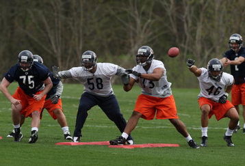 LAKE FOREST, IL - MAY 01: (L-R) Dave Peck #75, Marcus Freeman #58, Jarron Gilbert#73 and Al Afalava #46 of the Chicago Bears participate in a special teams drill during a rookie mini-camp practice on May 1, 2009 at Halas Hall in Lake Forest, Illinois.  (Photo by Jonathan Daniel/Getty Images)