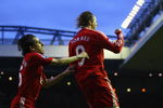 LIVERPOOL, ENGLAND - AUGUST 19:  Fernando Torres of Liverpool celebrates scoring the opening goal with team mate Yossi Benayoun (L) during the Barclays Premier League match between Liverpool and Stoke City at Anfield on August 19, 2009 in Liverpool, England.  (Photo by Clive Brunskill/Getty Images)