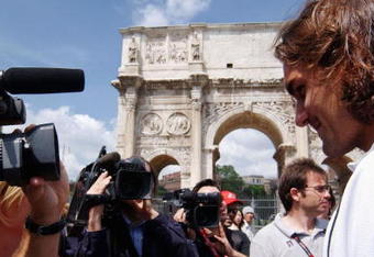 ROME, ITALY - MAY  2:  Roger Federer of Switzerland speaks to the press in front of the Costantino's arc during the tournament launch of the Telecom Italia Masters at Foro Italico on May 2, 2004 in Rome, Italy. (Photo by Franco Origlia/Getty Images)