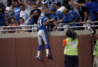DETROIT, MI - AUGUST 15: Running back Aaron Brown #21 of the Detroit Lions jumps in the stands to celebrate a touchdown against the Atlanta Falcons at Ford Field on August 15, 2009 in Detroit, Michigan. The Lions defeated the Falcons 27-26. (Photo by Scott Boehm/Getty Images)