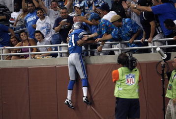 DETROIT, MI - AUGUST 15: Running back Aaron Brown #21 of the Detroit Lions jumps in the stands to celebrate a touchdown against the Atlanta Falcons at Ford Field on August 15, 2009 in Detroit, Michigan. The Lions defeated the Falcons 27-26. (Photo by Scott Boehm/Getty Images)