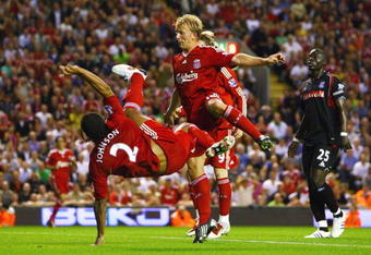 LIVERPOOL, ENGLAND - AUGUST 19:  Glen Johnson (L) of Liverpool scores his team's second goal during the Barclays Premier League match between Liverpool and Stoke City at Anfield on August 19, 2009 in Liverpool, England.  (Photo by Clive Brunskill/Getty Images)