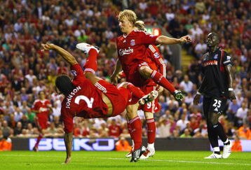 LIVERPOOL, ENGLAND - AUGUST 19:  Glen Johnson (L) of Liverpool scores his team's second goal during the Barclays Premier League match between Liverpool and Stoke City at Anfield on August 19, 2009 in Liverpool, England.  (Photo by Clive Brunskill/Getty Images)