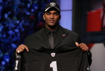NEW YORK - APRIL 28:  JaMarcus Russell poses with his Oakland Raiders jersey after being chosen first overall by the Oakland Raiders at the 2007 NFL Draft at Radio City Music Hall April 28, 2007 in New York City.  (Photo by Nick Laham/Getty Images)