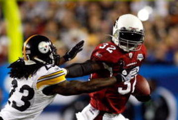 TAMPA, FL - FEBRUARY 01:  Edgerrin James #32 of the Arizona Cardinals runs the ball against Tyrone Carter #23 of the Pittsburgh Steelers during Super Bowl XLIII on February 1, 2009 at Raymond James Stadium in Tampa, Florida. Steelers won 27-23. (Photo by Chris Graythen/Getty Images)