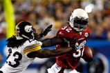 TAMPA, FL - FEBRUARY 01:  Edgerrin James #32 of the Arizona Cardinals runs the ball against Tyrone Carter #23 of the Pittsburgh Steelers during Super Bowl XLIII on February 1, 2009 at Raymond James Stadium in Tampa, Florida. Steelers won 27-23. (Photo by Chris Graythen/Getty Images)