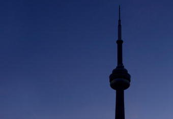 391776 01: (FILE PHOTO) The CN Tower and the Skydome highlight the Toronto skyline in his undated file photo. The International Olympic Committee (IOC) meets in Moscow July 13, 2001 to decide between front runners Beijing, Paris and Toronto for the site of the 2008 summer Olympics. (Photo by Carlo Allegri/Getty Images)