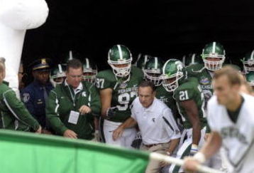 ORLANDO, FL - JANUARY 1: Coach Mark Dantonio of the Michigan State Spartans leads the team to the field for play against the Georgia Bulldogs at the 2009 Capital One Bowl at the Citrus Bowl on January 1, 2009 in Orlando, Florida.  (Photo by Al Messerschmidt/Getty Images) 