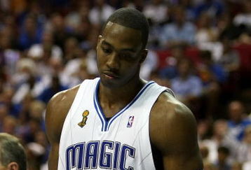 ORLANDO, FL - JUNE 14:  Dwight Howard #12 of the Orlando Magic looks down in the fourth quarter as the Magic trail the Los Angeles Lakers in Game Five of the 2009 NBA Finals on June 14, 2009 at Amway Arena in Orlando, Florida.  NOTE TO USER:  User expressly acknowledges and agrees that, by downloading and or using this photograph, User is consenting to the terms and conditions of the Getty Images License Agreement.  (Photo by Elsa/Getty Images)