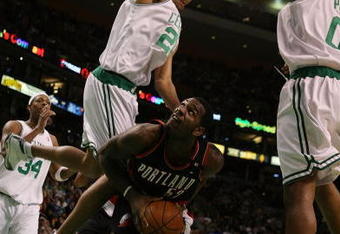 BOSTON - DECEMBER 05:  Patrick O'Bryant #26 and Leon Powe #0 of the Boston Celtics try to keep Greg Oden #52 of the Portland Trail Blazers from scoring on December 5, 2008 at TD Banknorth Garden in Boston, Massachusetts. The Celtics defeated the Trail Blazers 93-78.  NOTE TO USER: User expressly acknowledges and agrees that, by downloading and or using this Photograph, user is consenting to the terms and conditions of the Getty Images License Agreement.  (Photo by Elsa/Getty Images)