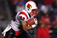 PISCATAWAY, NJ - DECEMBER 04: Victor Anderson #20 of the Louisville Cardinals runs the ball against the Rutgers Scarlet Knights at Rutgers Stadium on December 4, 2008 in Piscataway, New Jersey. (Photo by Jim McIsaac/Getty Images)