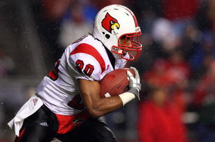 PISCATAWAY, NJ - DECEMBER 04: Victor Anderson #20 of the Louisville Cardinals runs the ball against the Rutgers Scarlet Knights at Rutgers Stadium on December 4, 2008 in Piscataway, New Jersey. (Photo by Jim McIsaac/Getty Images)