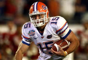 MIAMI - JANUARY 08:  Quarterback Tim Tebow #15 of the Florida Gators runs with the ball against the Oklahoma Sooners in the FedEx BCS National Championship Game at Dolphin Stadium on January 8, 2009 in Miami, Florida.  (Photo by Donald Miralle/Getty Images)