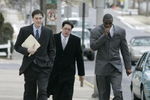 LEBANON - JANUARY 14: New York Giants wide receiver Plaxico Burress, right, walks with members of his legal team as he arrives at the Lebanon County Courthouse January 14, 2009 in Lebanon, Pa.  Burress is scheduled to appear in a civil trial in a dispute with an automobile dealer over what he owes in damages to a vehicle supplied to him by the dealership. (Photo by Chris Gardner/Getty Images)