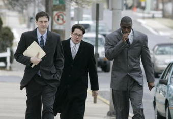 LEBANON - JANUARY 14: New York Giants wide receiver Plaxico Burress, right, walks with members of his legal team as he arrives at the Lebanon County Courthouse January 14, 2009 in Lebanon, Pa.  Burress is scheduled to appear in a civil trial in a dispute with an automobile dealer over what he owes in damages to a vehicle supplied to him by the dealership. (Photo by Chris Gardner/Getty Images)