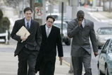 LEBANON - JANUARY 14: New York Giants wide receiver Plaxico Burress, right, walks with members of his legal team as he arrives at the Lebanon County Courthouse January 14, 2009 in Lebanon, Pa.  Burress is scheduled to appear in a civil trial in a dispute with an automobile dealer over what he owes in damages to a vehicle supplied to him by the dealership. (Photo by Chris Gardner/Getty Images)