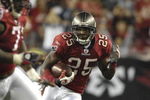 TAMPA, FL - OCTOBER 19: Cornerback Aqib Talib #25 of the Tampa Bay Buccaneers returns an interception against the Seattle Seahawks at Raymond James Stadium on October 19, 2008 in Tampa, Florida.  (Photo by Al Messerschmidt/Getty Images) 