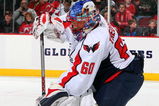 NEWARK, NJ - FEBRUARY 03:  Jose Theodore #60 of the Washington Capitals skates against the New Jersey Devils at the Prudential Center on February 3, 2009 in Newark, New Jersey. The Capitals defeated the Devils 5-2.  (Photo by Jim McIsaac/Getty Images)