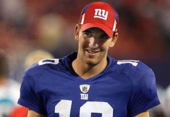 EAST RUTHERFORD, NJ - AUGUST 17:  Eli Manning #10 of the New York Giants walks off the field after a preseason NFL game against the Carolina Panthers on August 17, 2009 at Giants Stadium in East Rutherford, New Jersey. The Giants defeated the Panthers 24-17.  (Photo by Jim McIsaac/Getty Images)